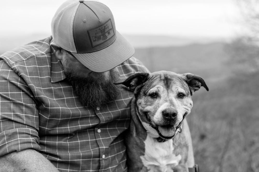 Handler sharing a quiet moment with a dog
